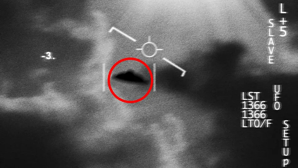 A UFO is circled in red in a black and white surveillance image