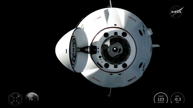 A SpaceX Dragon capsule approaches the International Space Station for docking
