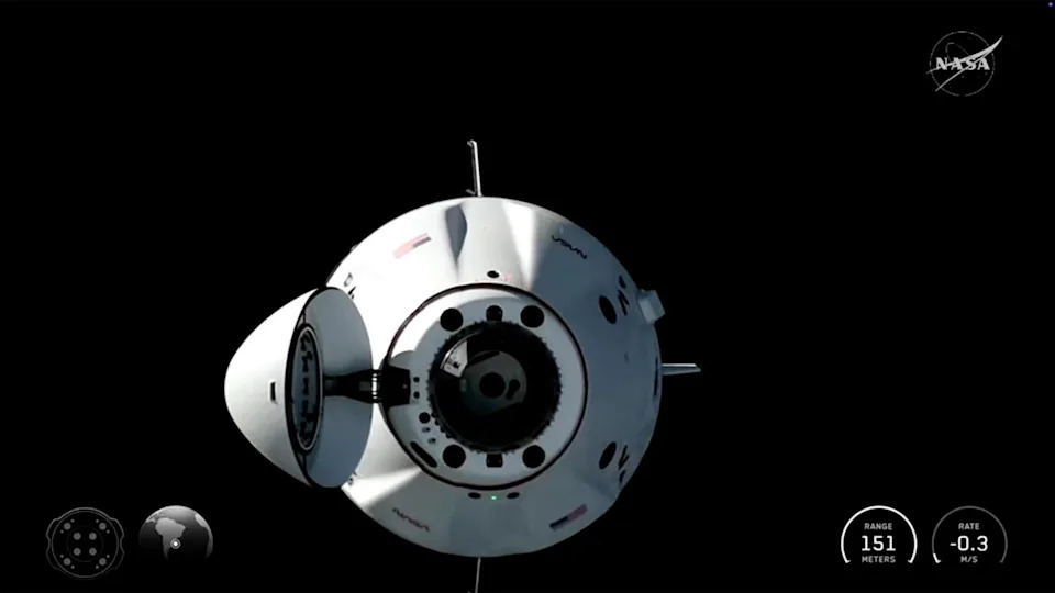 The Crew Dragon closes in on the International Space Station after a smooth rendezvous, bringing four fresh crew members to the outpost. Feb. 14, 2026.  / Credit: NASA