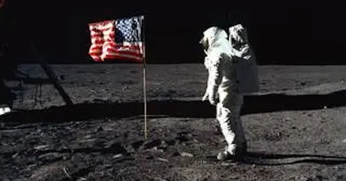 Neil Armstrong with the US flag on the moon