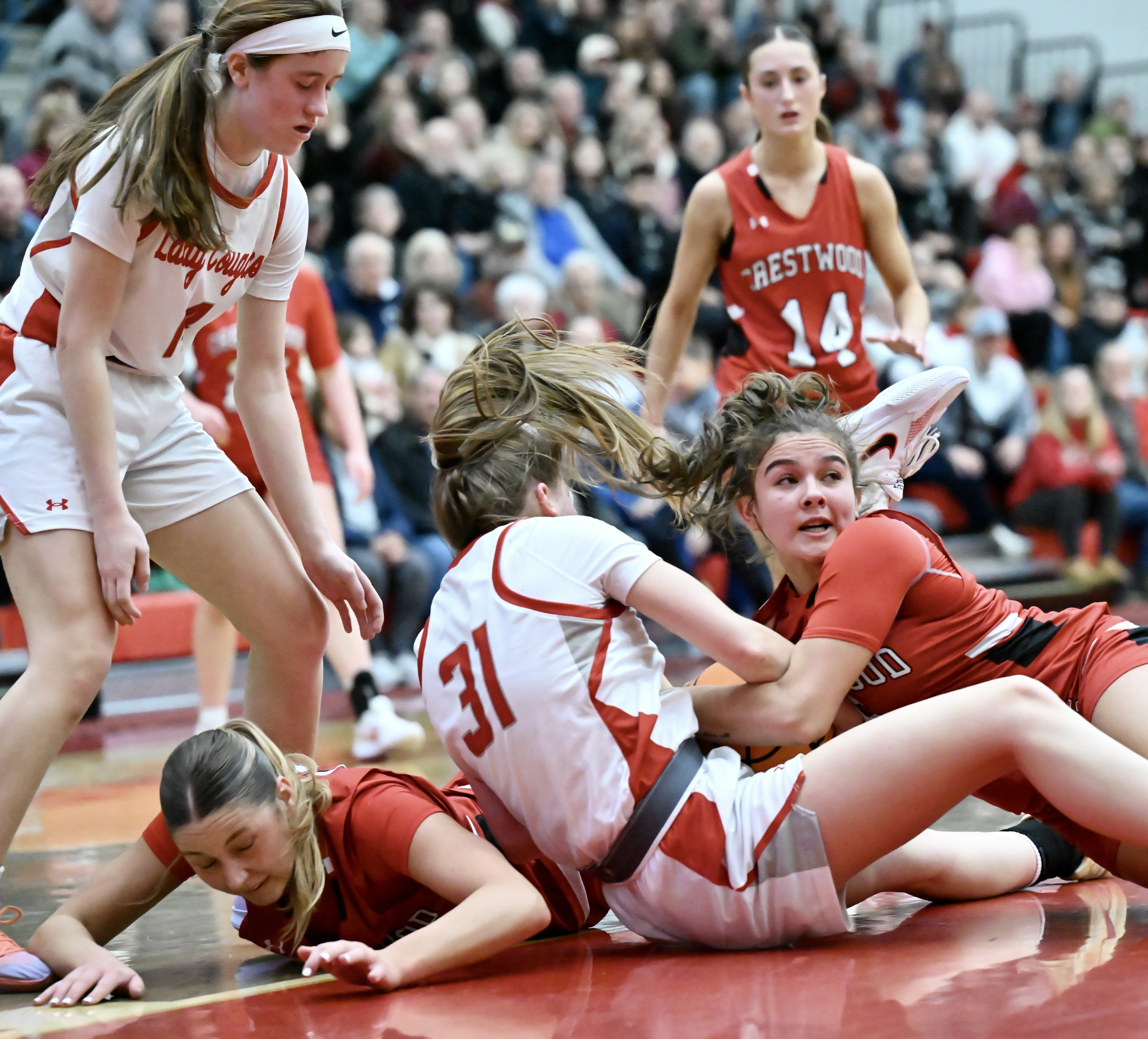 Hazleton Area’s Alexis Reimold (31) and Crestwood’s Cameron Vieney (5)...