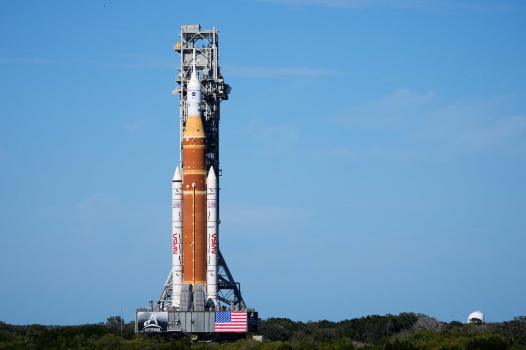 NASA's new moon rocket, Artemis II, slowly makes its way to pad 39B at the Kennedy Space Center on Jan. 17 in Cape Canaveral, Fla.