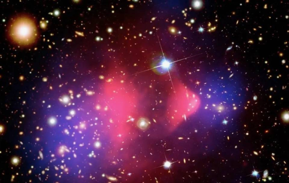 bright white stars sit atop purple and red star clouds in dark space
