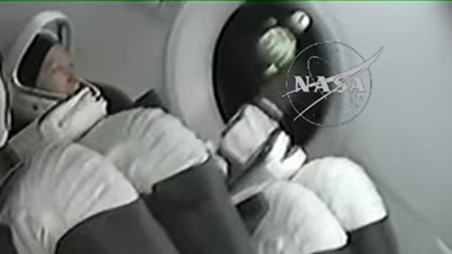 a zoomed in shot on a floating crocheted zero gravity indicator of earth, moon, bananas and more