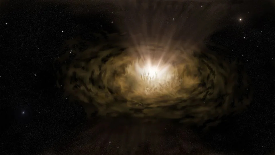  A yellowish hazy light is seen surrounded by a disk of dust in this illustration. 