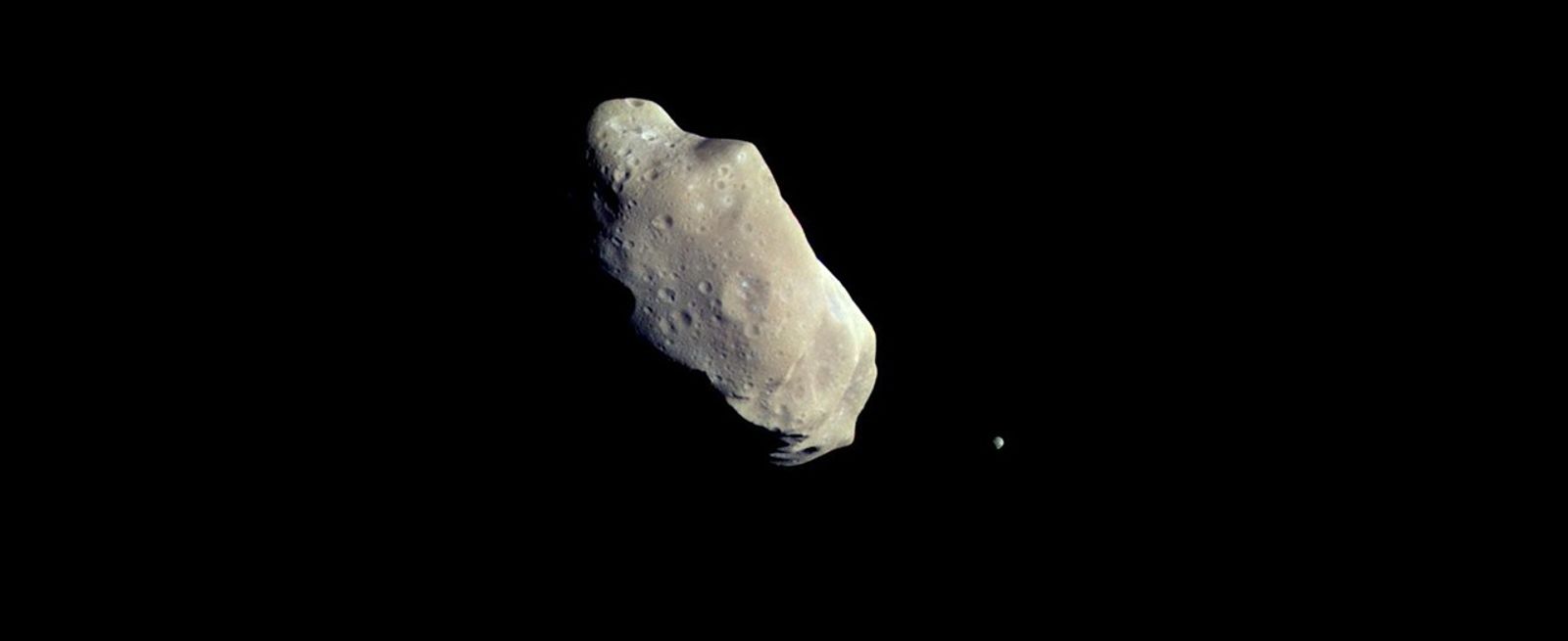 two rocky asteroids in black space