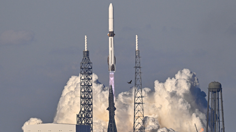 Blue Origin's New Glenn rocket takes off in a plume of smoke.