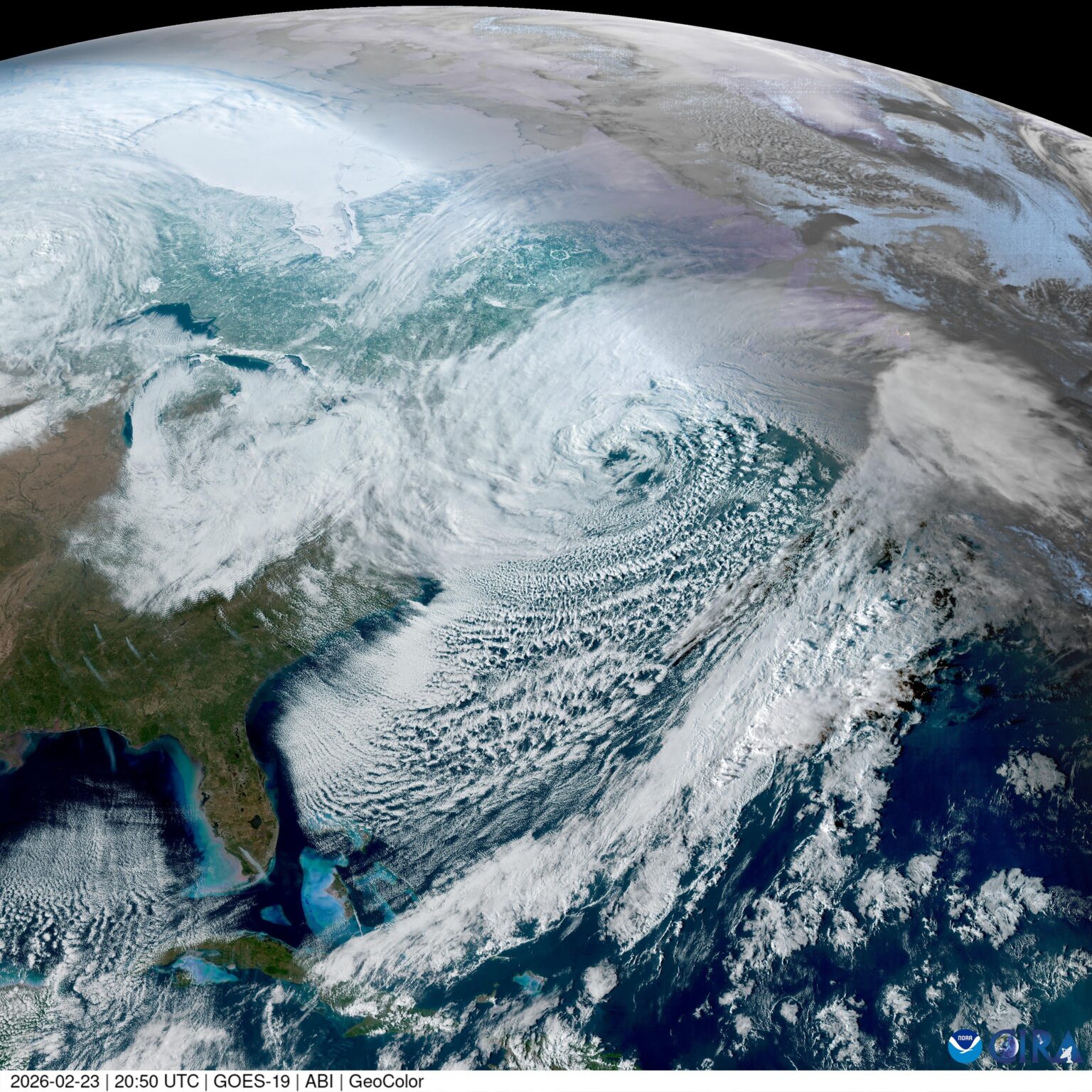 An imposing nor’easter swirls just off the east coast of the United States and Canada, battering it with a powerful winter storm.