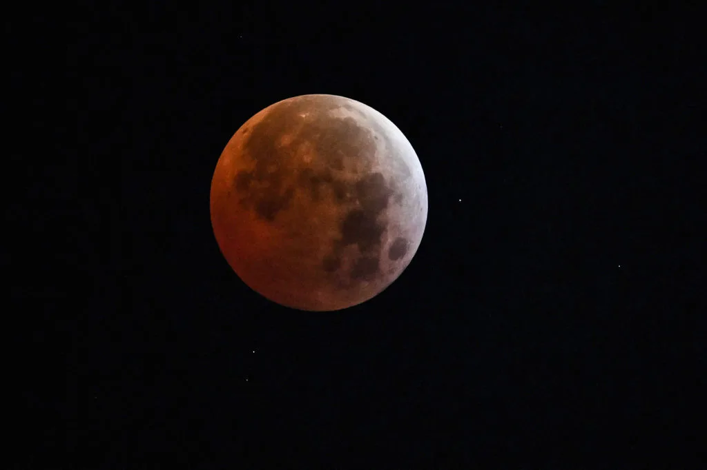 The total lunar eclipse of March 14, 2025 over Caracas, Venezuela. Photo by JUAN BARRETO/AFP via Getty Images
