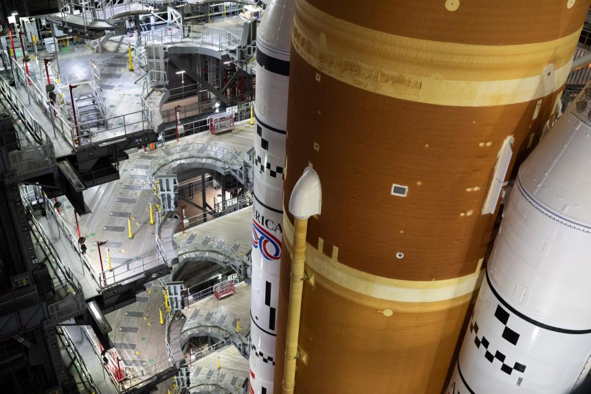 NASA’s Artemis II Space Launch System, or SLS, rocket and Orion spacecraft, secured to the mobile launcher, is seen inside the Vehicle Assembly building on January 16 at NASA’s Kennedy Space Center in Florida.