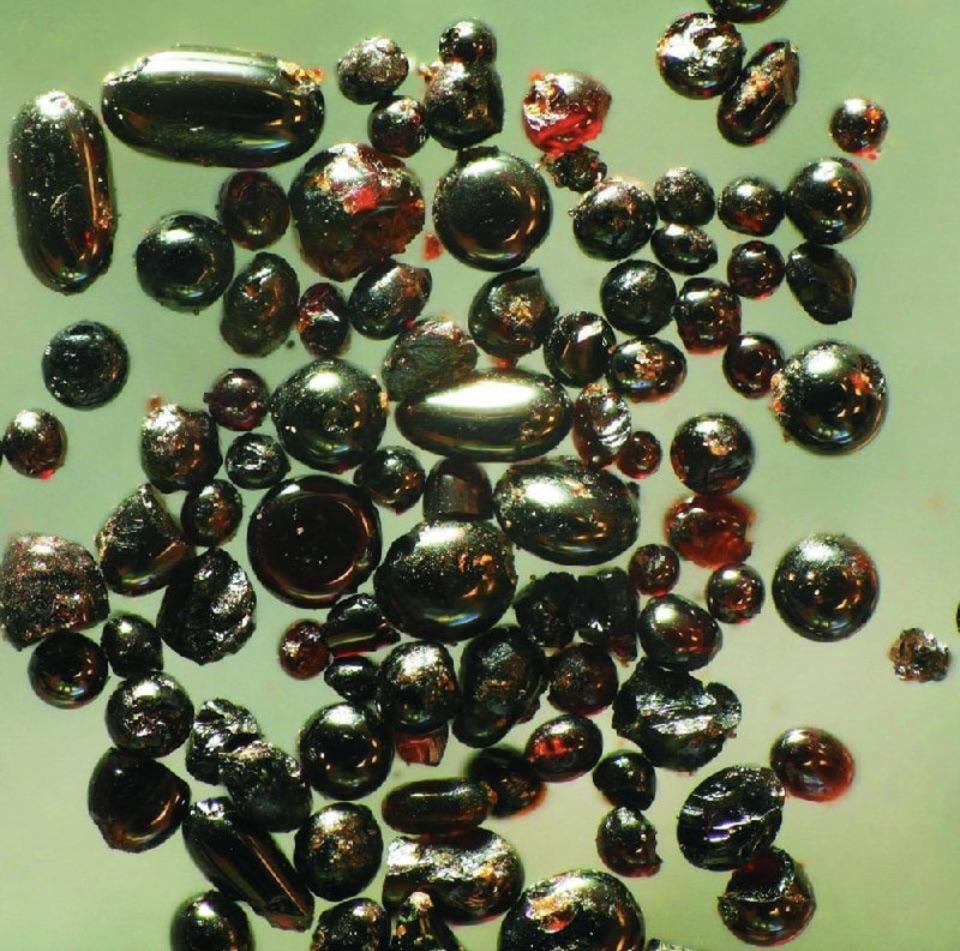 These tiny glassy spheres are a 340-fold magnification of the lunar soil that Apollo 17 astronauts found in a crater in the Taurus-Littrow Valley of the moon.