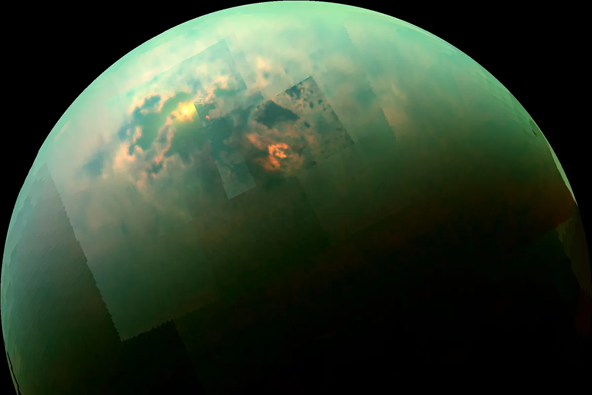 An infrared view of the Saturn moon Titan showing sunlight reflected off its polar lakes. Credits: NASA/JPL-Caltech/Univ. Arizona/Univ. Idaho