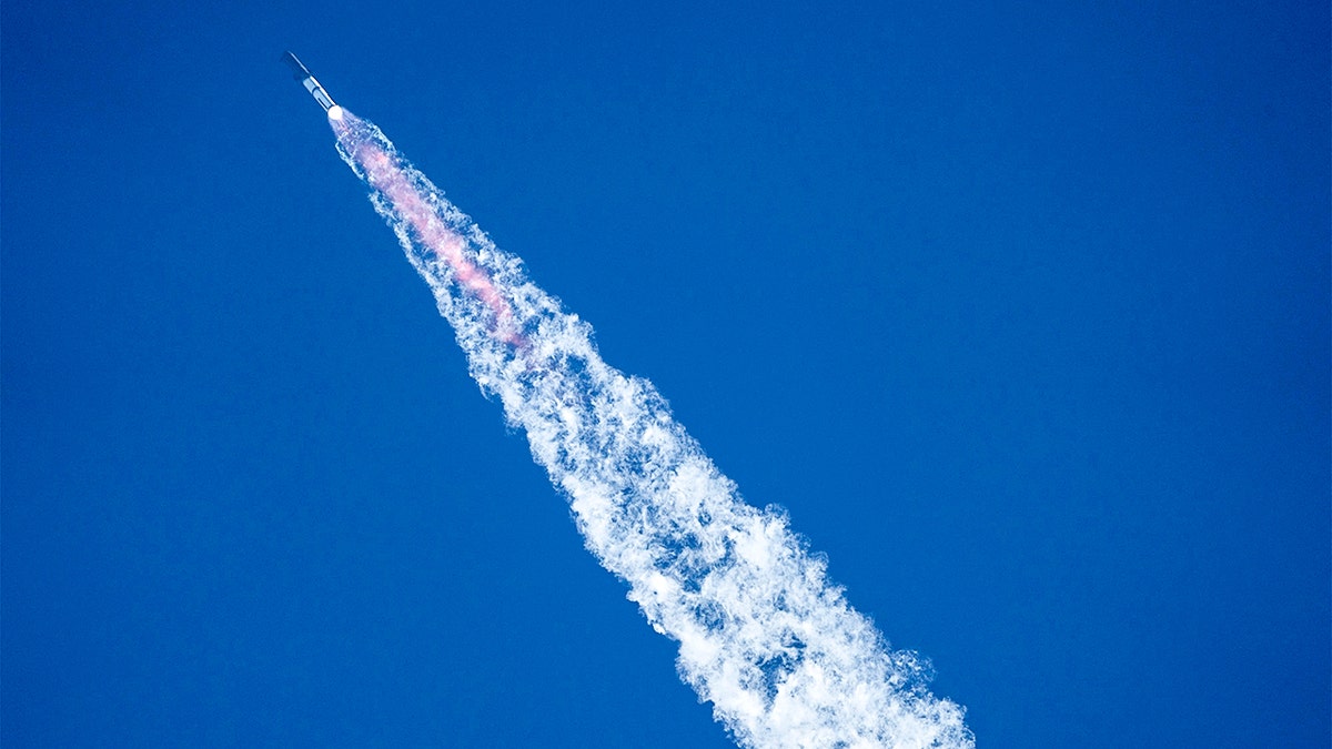 Fire plumes out of rocket and it launches into space.