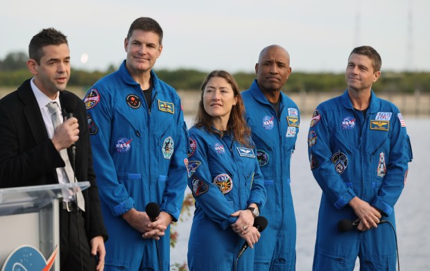 NASA administrator Jared Isaacman talks to the media as the Artemis II crew: Jeremy Hansen, mission specialist, Canadian Space Agency; Christina Koch, mission specialist, NASA; Victor Glover, pilot, NASA; and Reid Wiseman, spacecraft commander, NASA; look on, as the Artemis II rocket rolls out to Launch Complex 39-B at the Kennedy Space Center, on Saturday, January 17, 2026. (Ricardo Ramirez Buxeda/ Orlando Sentinel)