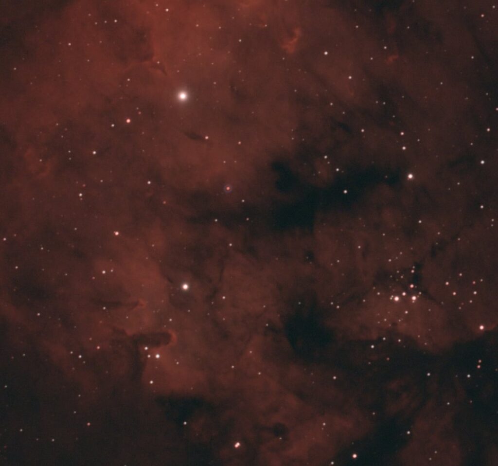 Blue ring around star in NGC7822