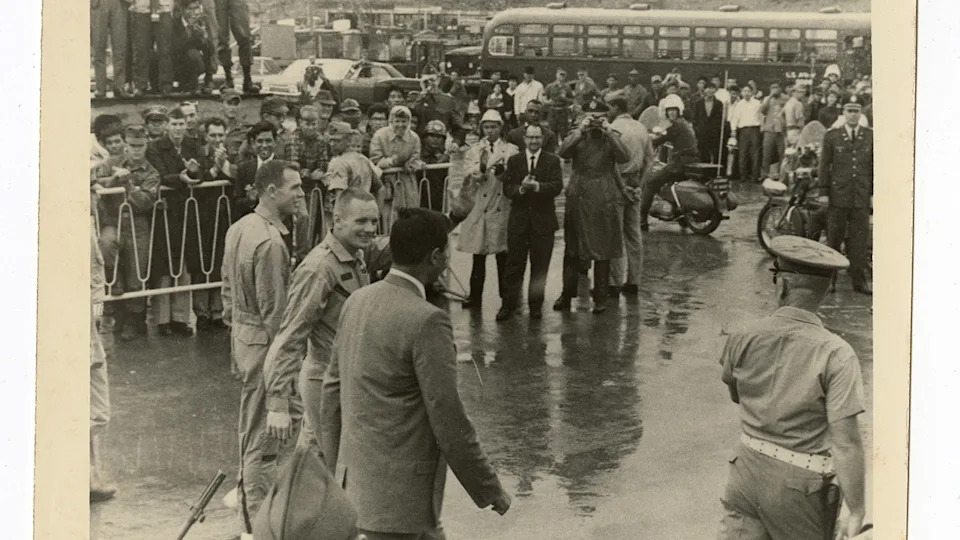 Neil Armstrong David Scott waving to service members