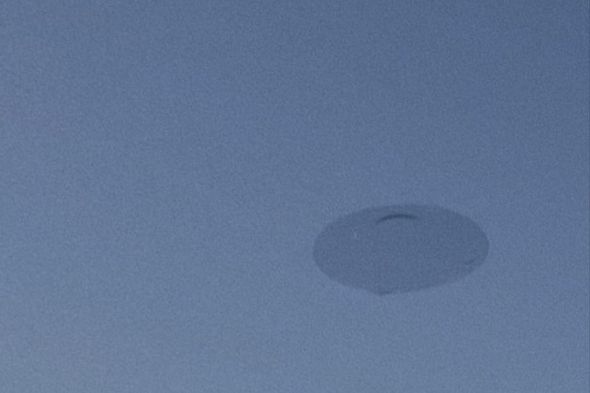 Gideon Allen claims he spotted this 'classic flying saucer' hovering over the Albert Dock