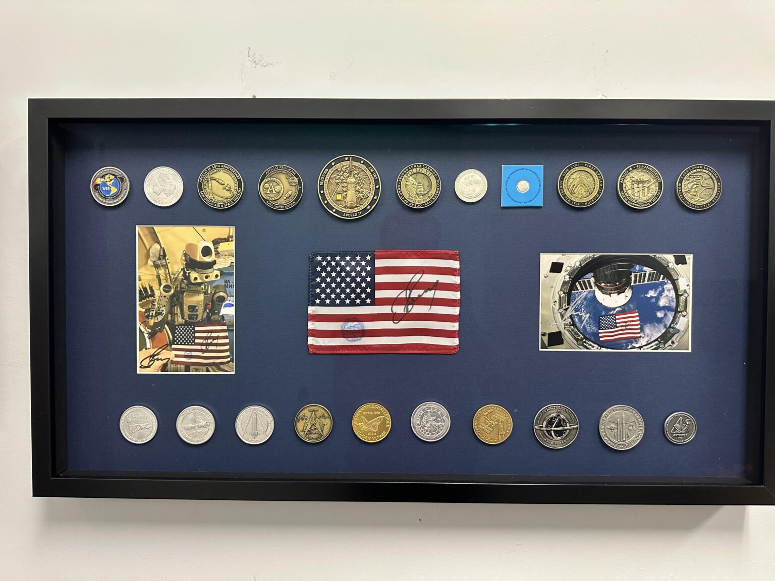My space collection, featuring medallions containing space-flown (or launchpad) material, and a flag flown on the ISS. I thought you all might enjoy seeing it!