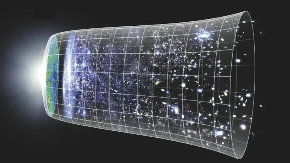 A cylinder-like shape with stars within. There's a glow toward the left and a grid pattern all around it.