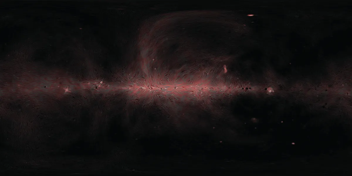 Electrons from within our Galaxy and beyond spiral round the magnetic field lines. As they do, they emit radio waves detected by Planck.