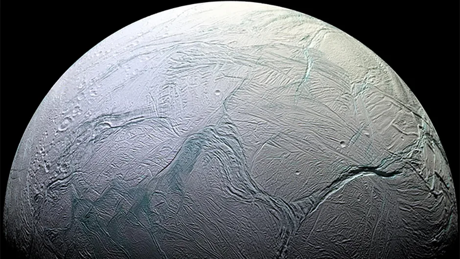 The cratered moon Enceladus. Cassini data has revealed a subsurface ocean beneath its icy crust. Image Credit: NASA/JPL-Caltech/Space Science Institute