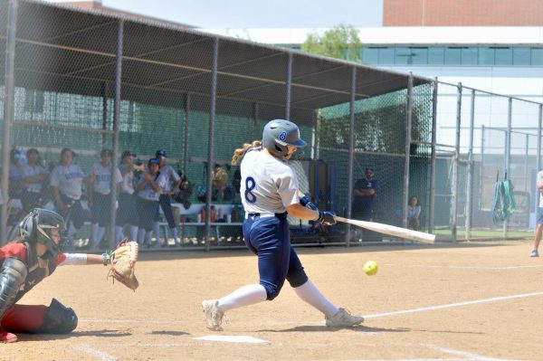 El Camino Warriors Catcher and Outfielder, Trinity Martinez, makes solid contact with the ball against the Palomar Comets on March 25, 2026. ( Riley Abrams | The Union )