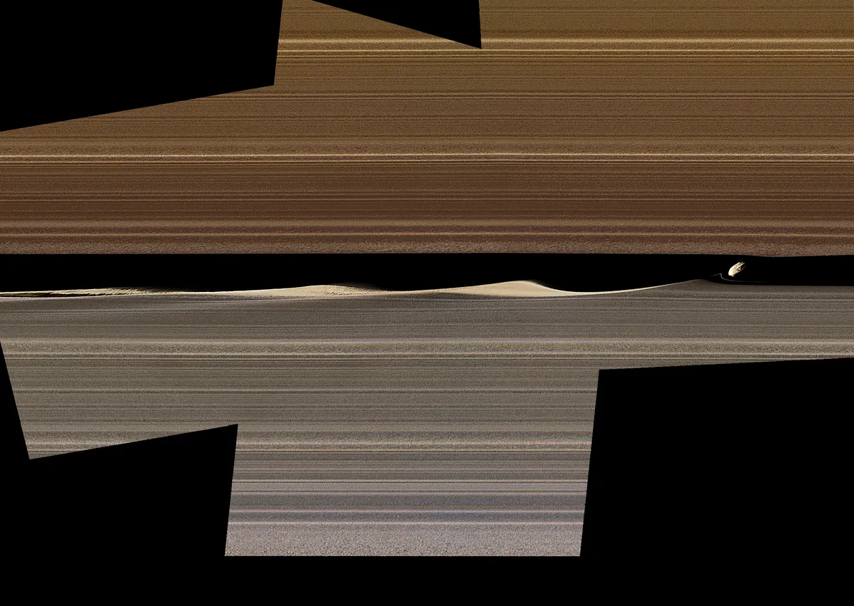 An enhanced colour image of Daphnis embedded in Saturn's rings, kicking up waves of material. The images in the mosaic were taken in visible light, using the Cassini's narrow-angle camera at a distance of approximately 28,000km from the ring moon. Image scale is 170m per pixel. Credit: Tilmann Denk at Freie Universität in Berlin.