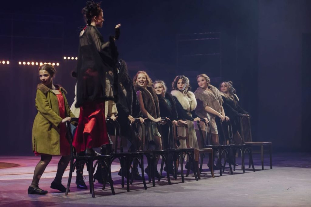 Julia Pearce HS on stage in costume