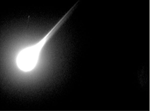 A bright fireball meteor entering Earth's atmosphere