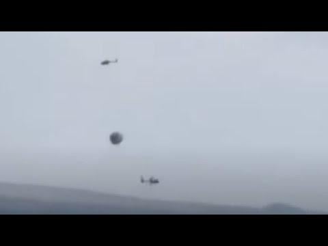 Exciting video of helicopters exploring and communicating with a UFO, filmed in Nevada.