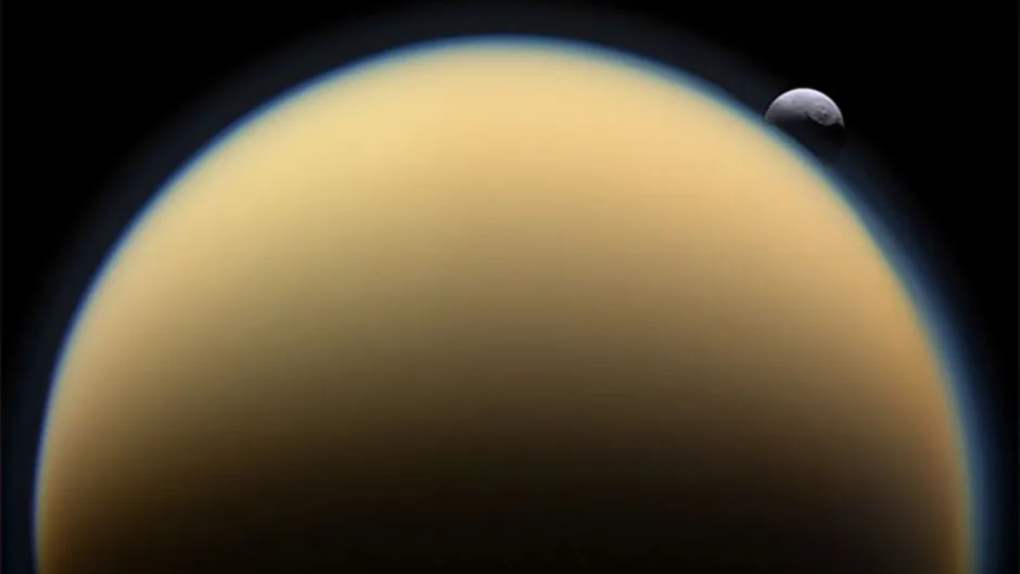 Like Earth, Titan has an atmosphere, seen here as a hazy blue outline around the moon’s limb. But Cassini scientists have discovered another similarity between our planet and Saturn’s largest moon.To the upper left of Titan in this image taken by the Cassini spacecraft is Tethys, another of Saturn’s satellites.Credit: Cassini Imaging Team, ISS, JPL, ESA, NASA