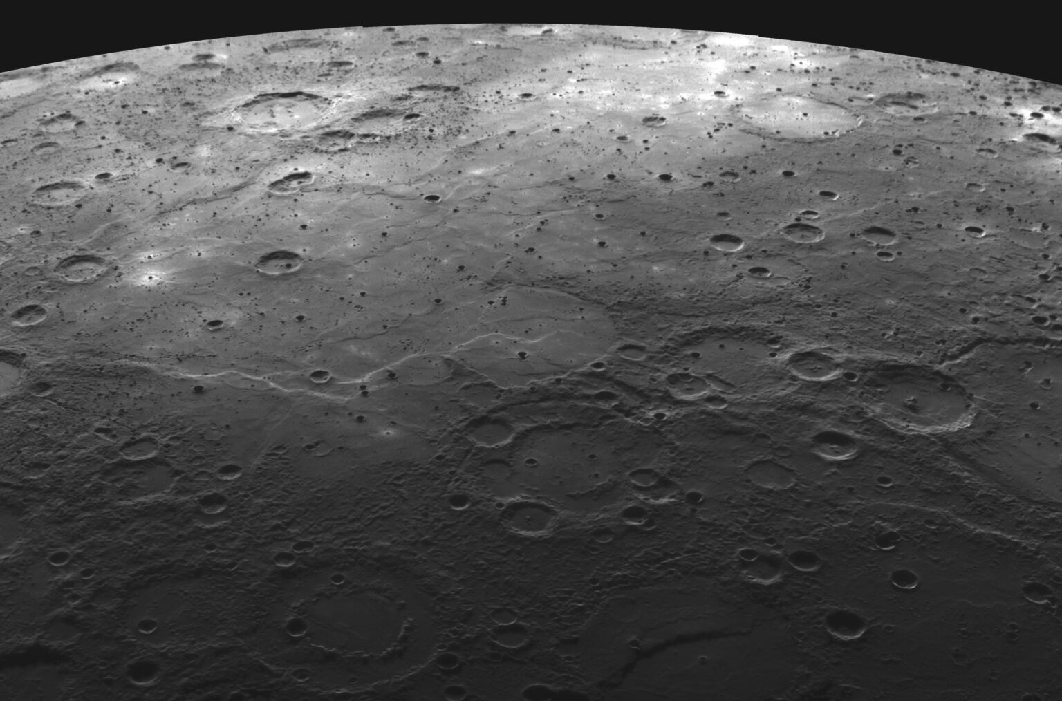Spacecraft Messenger image of the lava-flooded craters and large expanses of smooth volcanic plains on Mercury.