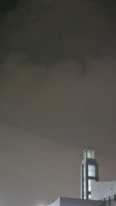 Three orbs during thunderstorm