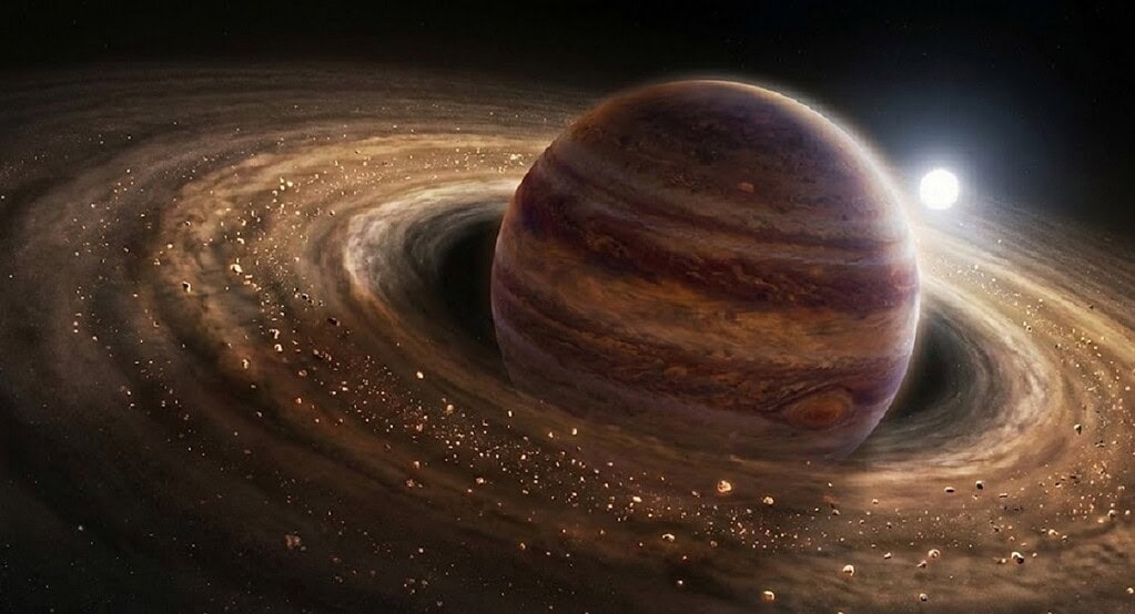 Planet with rings and distant star in space.