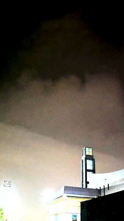 Three orbs during thunderstorm (repost with increased exposure and contrast)