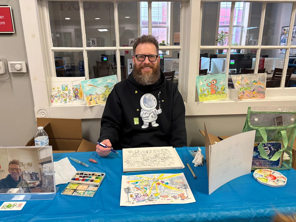 Seth Holmes of Holmes Watercolors illustrated ‘Alien Takeover’ stories written by Waynesboro Area School District students. The stories were displayed in downtown business windows for a StoryWalk on March 14, 2026. Holmes visited with students, talked about his work and gave them the illustrations on March 20.
