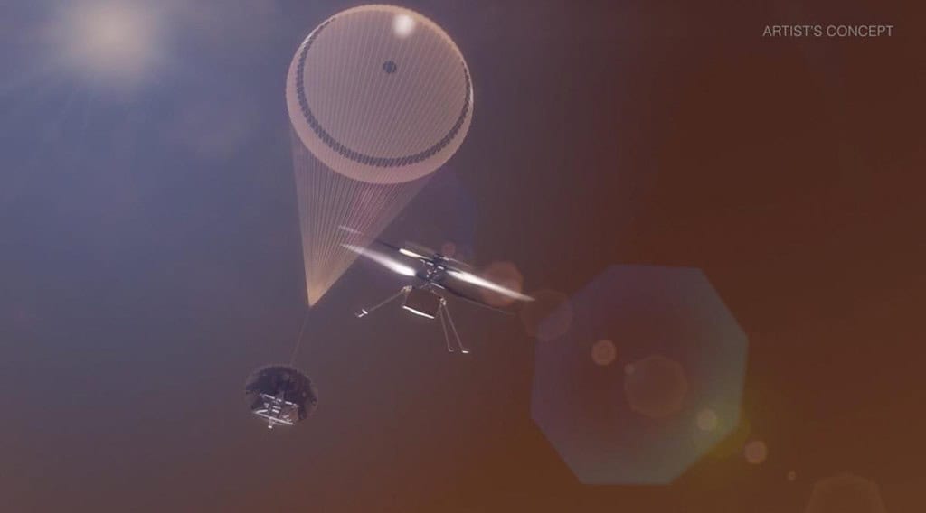 High-altitude drone with parachute descending from the sky during sunset.