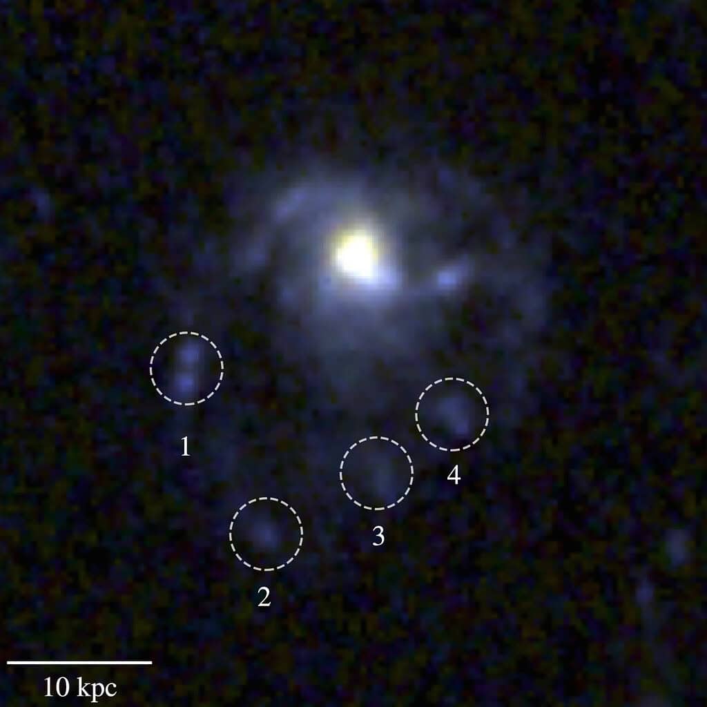 Supermassive black hole surrounded by multiple star clusters in a distant galaxy.