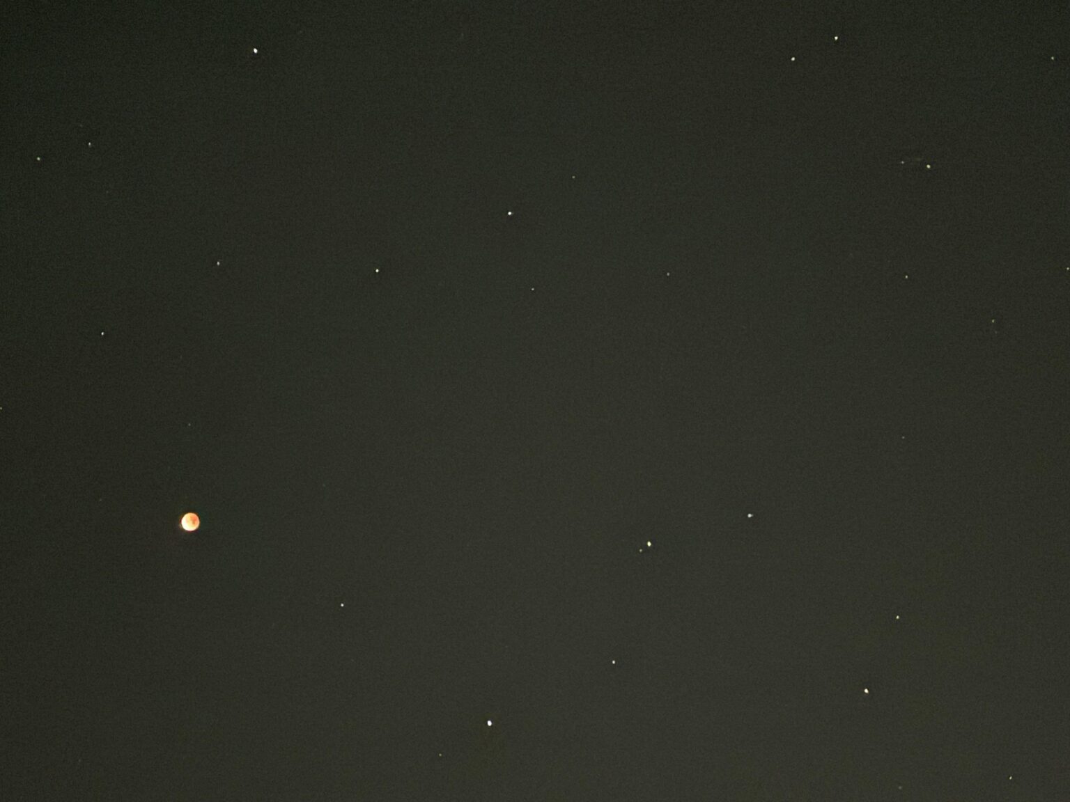 Eclipsed moon and constellation Leo