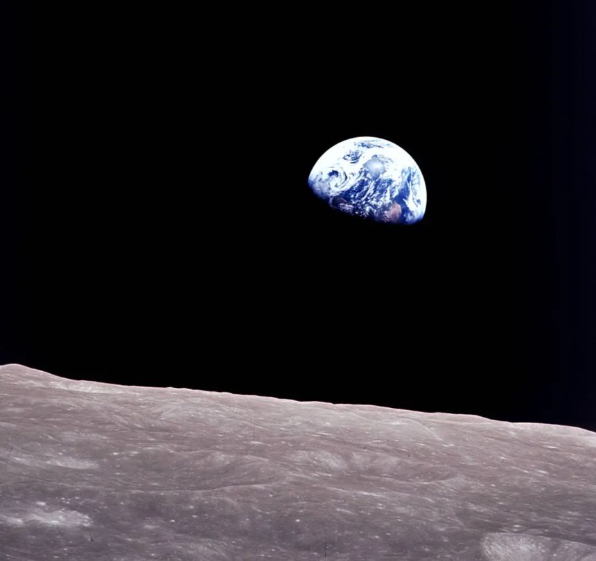 Taken by Bill Anders aboard Apollo 8, this iconic picture shows Earth peeking out from beyond the lunar surface as the first crewed spacecraft circumnavigated the moon.<br />Image Credit: NASA