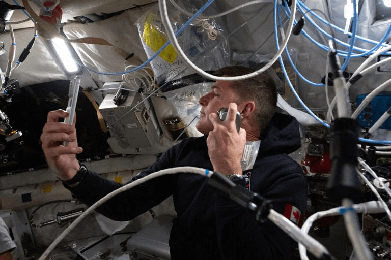 Artemis II mission specialist and CSA (Canadian Space Agency) astronaut Jeremy Hansen enjoys a shave inside the Orion spacecraft. (NASA