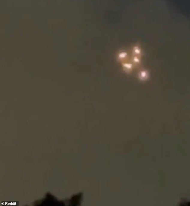 The clip has flooded social media, where users are debating whether the lights are extraterrestrials or parachuters with flares