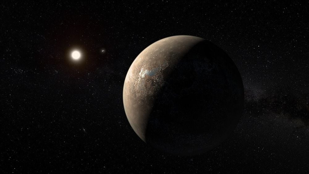 This artist's illustration shows Proxima Centauri b as a rocky Super-Earth, which is only one of its possible types according to our limited data. It orbits Proxima Centauri, which is also shown. To the right of Proxima Centauri is the Alpha Centauri binary star system. Image Credit: By ESO/M. Kornmesser - https://www.eso.org/public/images/ann16056a/, CC BY 4.0, https://commons.wikimedia.org/w/index.php?curid=50869082