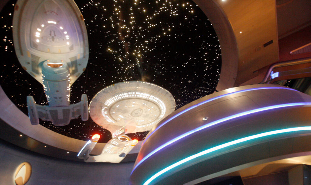 Hollywood’s narrative on UFOs and ETs reaches back many decades FILE - Model ships hang at the entrance to the Star Trek Experience at the Las Vegas Hilton in Las ...
