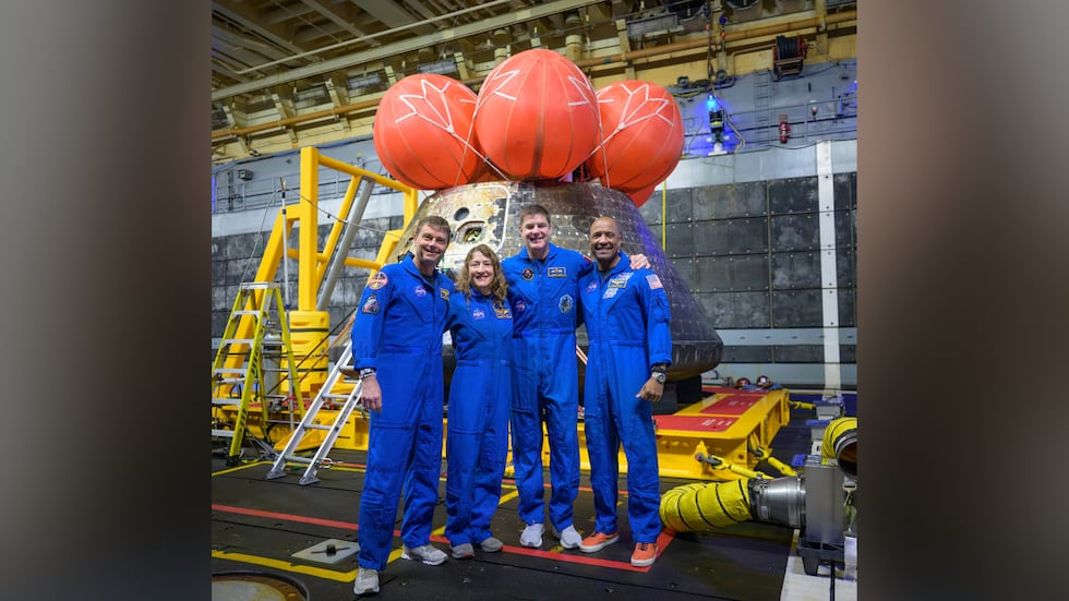 NASA astronauts Reid Wiseman, commander; Christina Koch, mission specialist; CSA (Canadian...