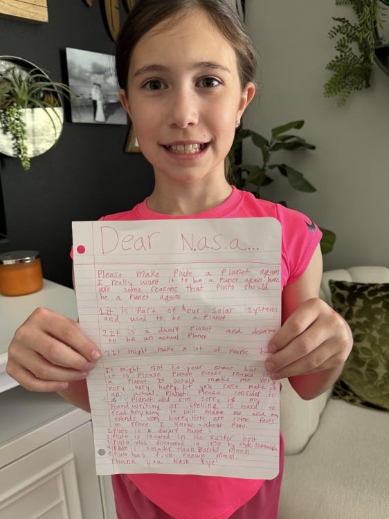 Kaela Polkinghorn showing the letter she wrote to NASA