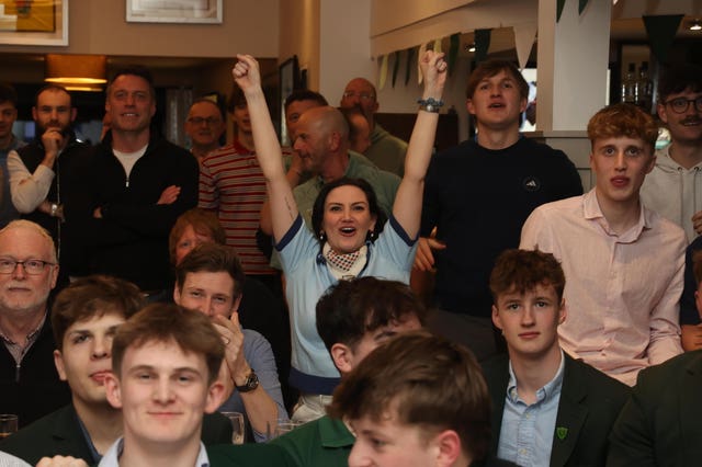 Holywood Golf Club members watch the final day of the US Masters 2026