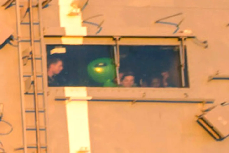 Inflatable green alien captured in windowCredit: Bill Ingalls/NASA via Getty