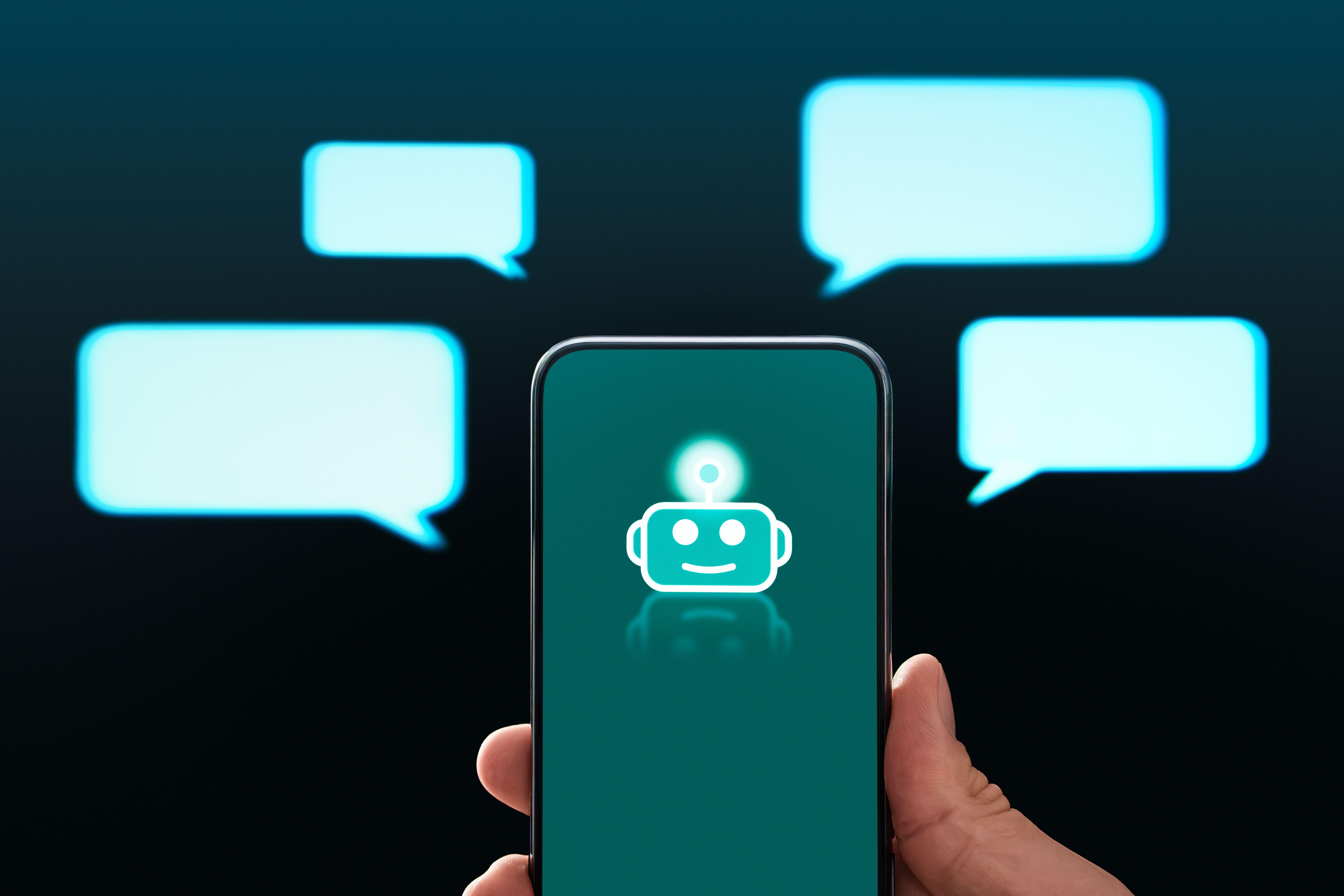 AI chatbot icon on a phone screen surrounded by speech bubbles