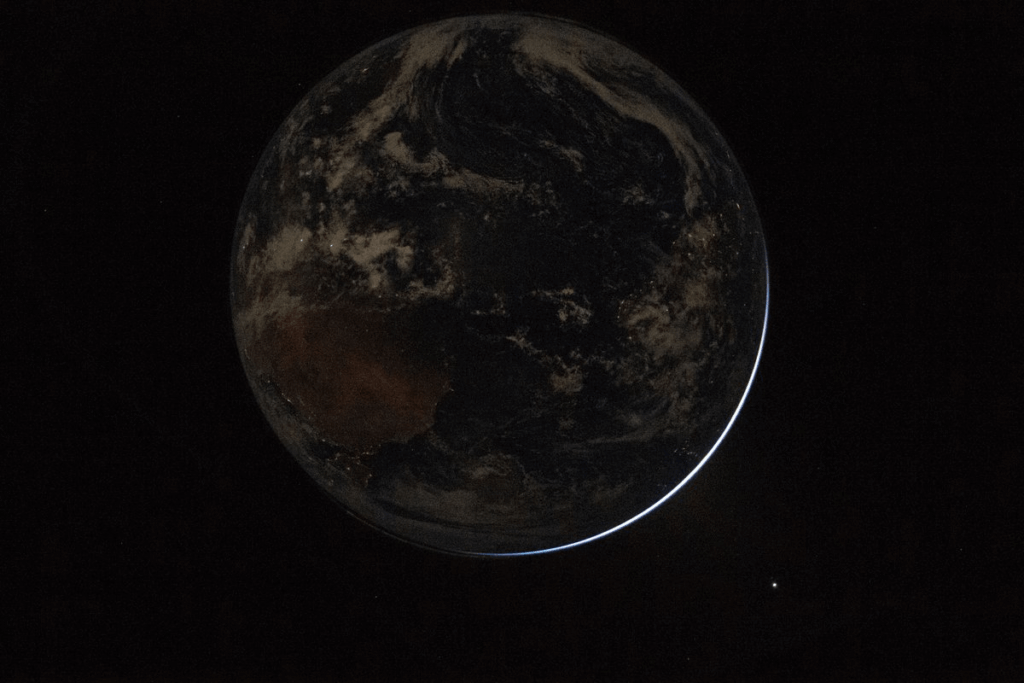 Earth shrouded in darkness (Taken from Artemis II)